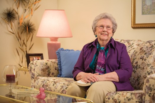 Senior Woman In Purple Sweater