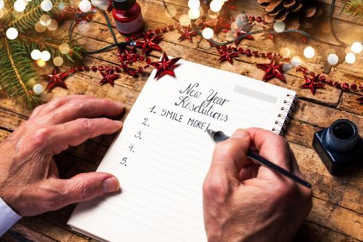 Senior gentleman making New Years resolutions list