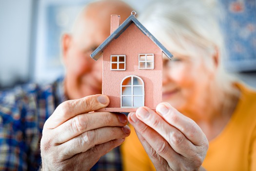 Photo of seniors with doll house, getting ready to move into Fellowship Square Senior Living Community in AZ