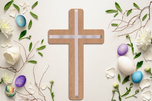 Photo of a wooden cross with easter eggs