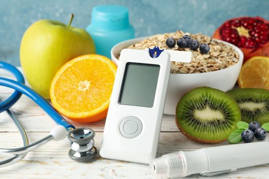 Photo of diabetes-healthy foods and blood glucose monitor