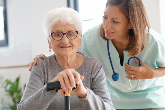 smiling elder and medical professional