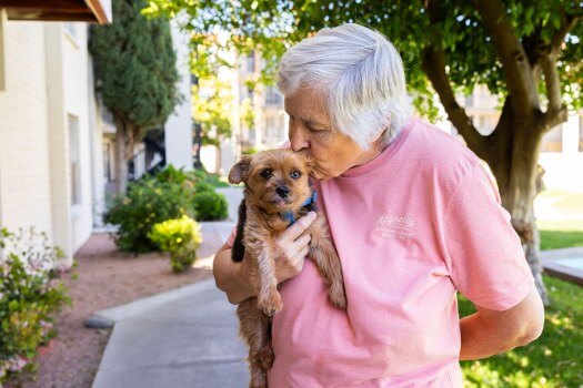 Senior woman with her dog at Fellowship Square senior living in Tucson